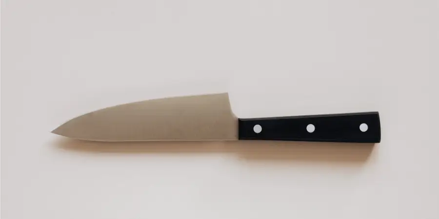 How long is 8 inches compared with kitchen chef knife on plain background