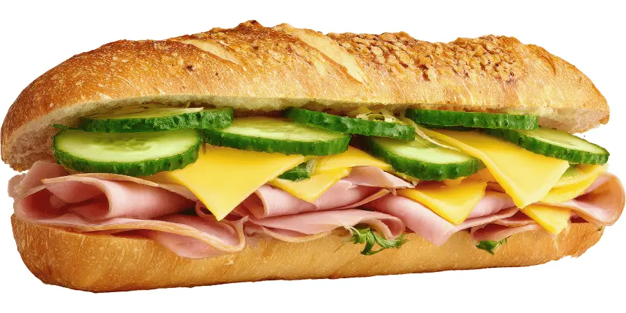Fresh sub sandwich with meat cheese and cucumber slices in bread, a common food item useful for visualizing a 6 inch length size