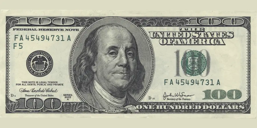 US one hundred dollar bill showing standard size and design, a common currency note useful for estimating length close to inches