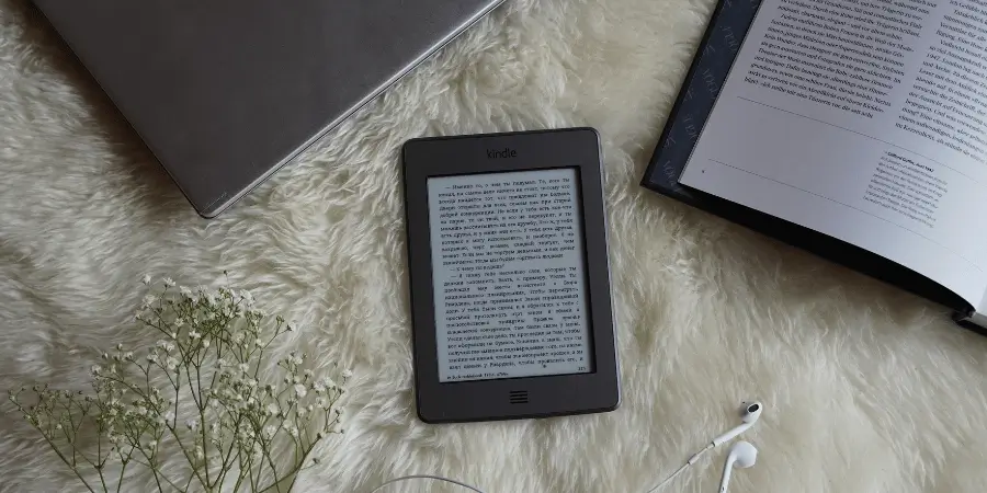 Kindle Paperwhite e reader on soft fabric as an example of things that are 7 inches long in daily life